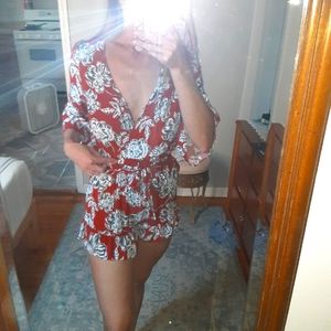 Burnt orange floral romper with ruffles